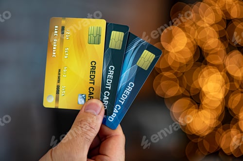 Preview: Man hold tree credit cards bokeh background