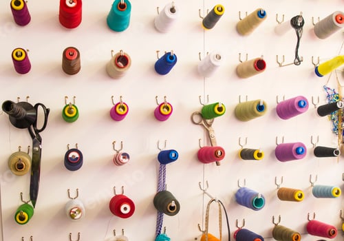 Preview: Multicolored coils and scissors on the wall