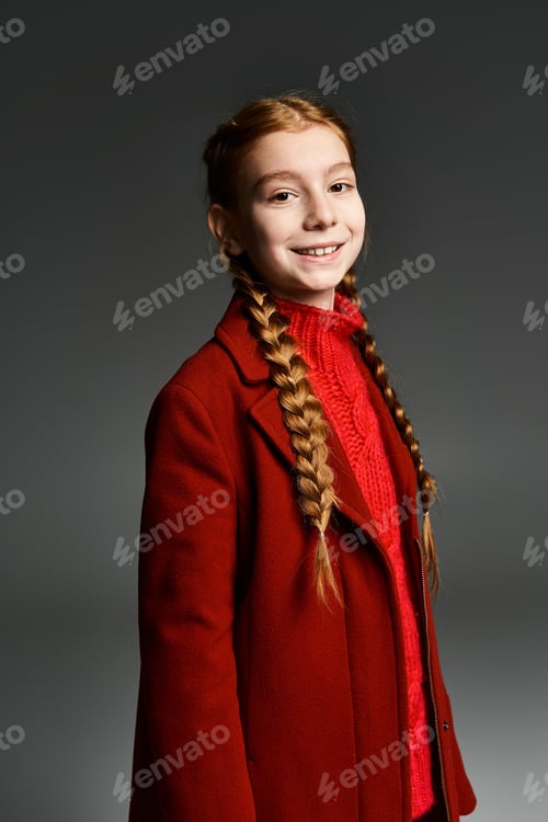 Preview: A cheerful young girl smiles brightly while wearing warm winter clothing, showcasing a cozy vibe
