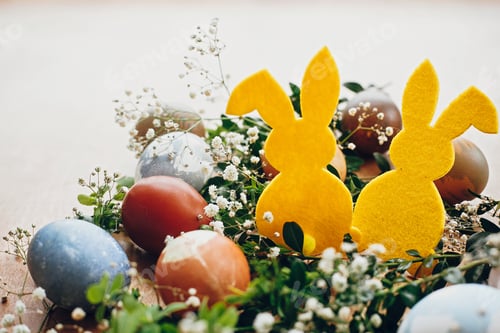 Preview: Natural dyed easter eggs and rabbit decorations on wooden background