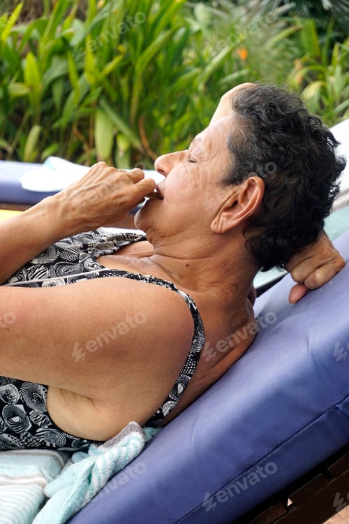 Preview: Woman Relaxing Outdoors on Lounge Chair
