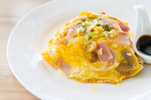 Preview: Scrambled omlette eggs with pork ham on rice.