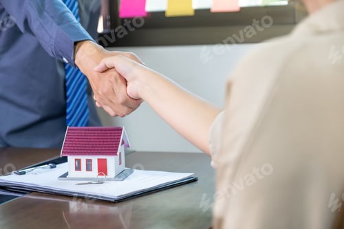 Preview: Real estate agents and buyers handshake after signing a business contract, renting, buying, mortgage