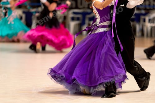 Preview: young couples dancers dancing waltz in dancesport competition