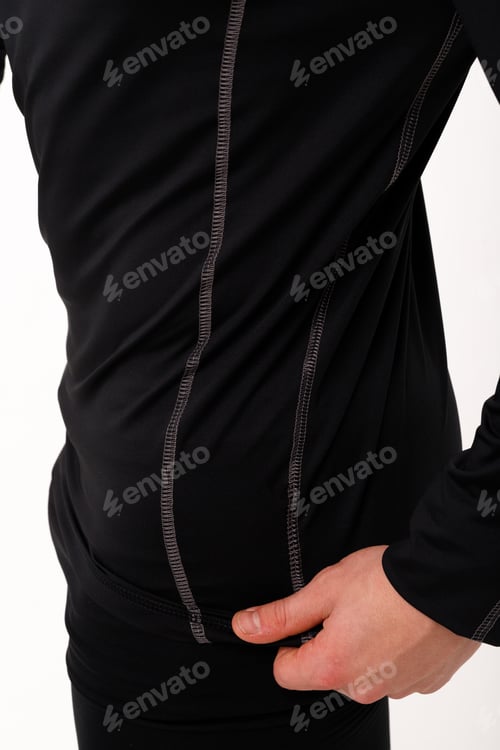 Preview: A man with a sporty physique in thermal underwear.