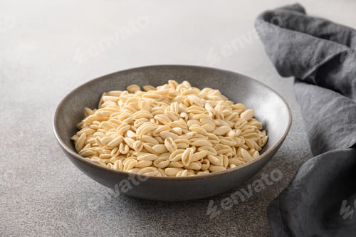 Preview: Pasta Cavatelli in bowl on gray background.