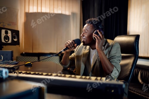 Preview: Sound engineer holds microphone, recording studio