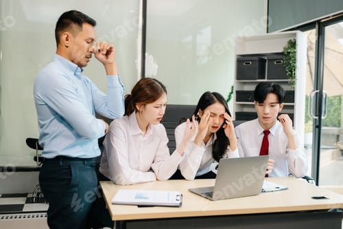 Preview: A business team in a tense meeting, dealing with stress and frustration facing a challenging