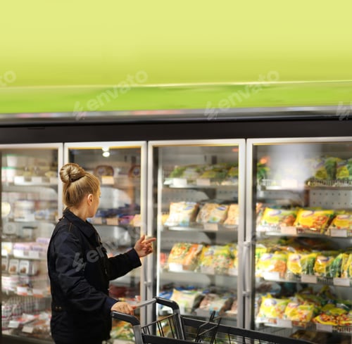 Preview: Woman Choosing Frozen Food From A Supermarket Freezer