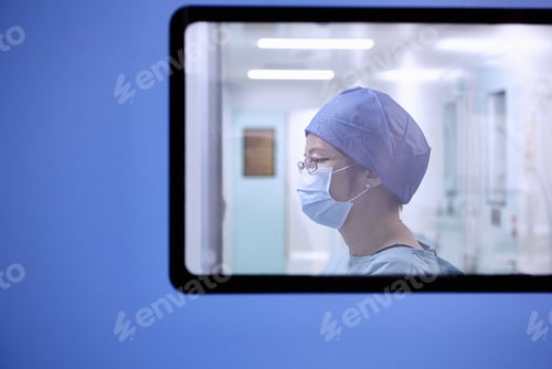 Preview: Window view of two female surgeon in maternity ward operating theatre