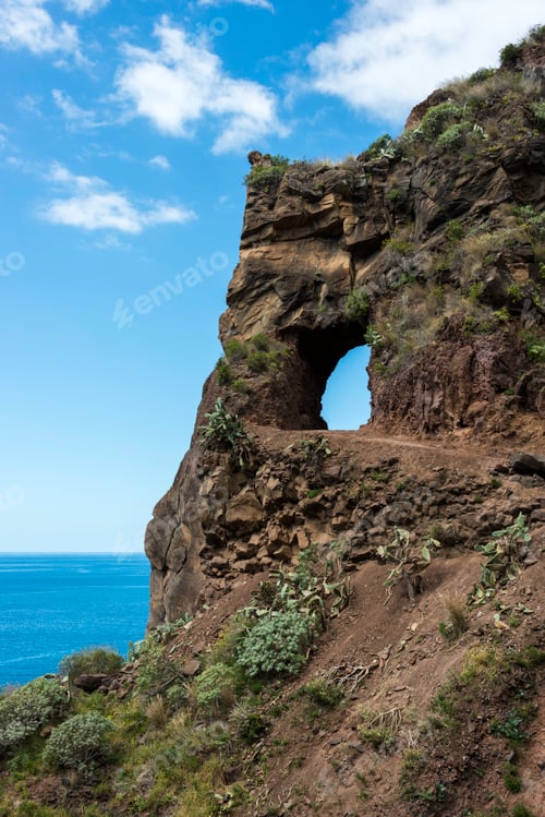 Preview: rocks with hole with blue sky view