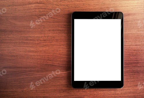 Preview: Top view of blank screen tablet on dark table