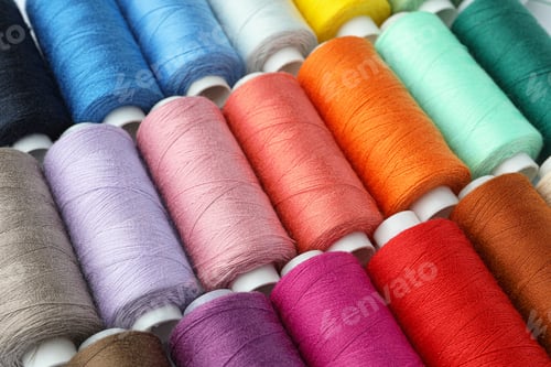 Preview: Set of different colorful sewing threads as background, closeup