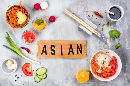 Preview: Asian rice noodles with vegetables and vegetarian salad on a plate on stone background