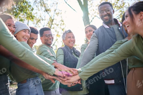 Preview: Team, motivation and friends in a huddle while hiking together in the forest or woods from below. F