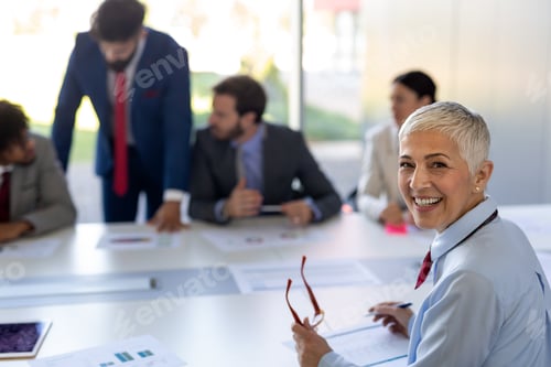 Preview: Business colleagues in conference meeting room during presentation