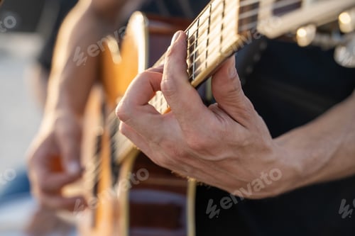 Preview: Musician Playing Acoustic Guitar - passionate hans closeup.