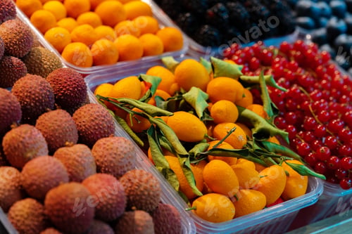 Preview: Colorful fruit berries are displayed in a market