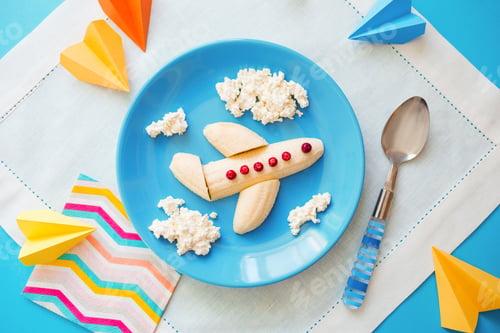 Preview: Fun food idea for kids. children's Breakfast: plane made of banana and clouds