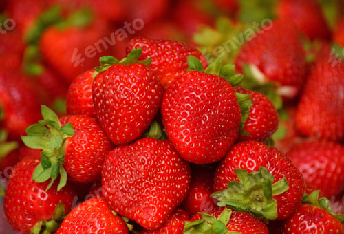 Preview: Close up heap of fresh strawberry on retail display