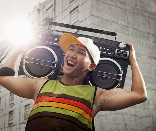 Preview: A young person with a boombox on the street of a city.