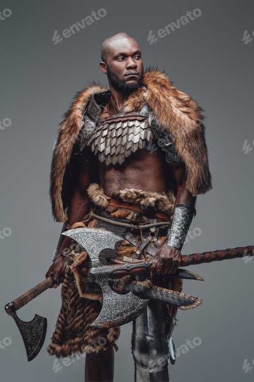 Preview: Portrait of a black skinned wild man with two huge axes in gray background