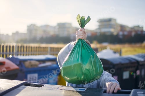 Preview: Man carrying garbage bag