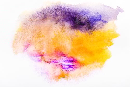 Preview: top view of pink, yellow and purple watercolor spills on white paper