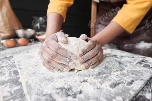 Preview: Woman kneading a dough for cake