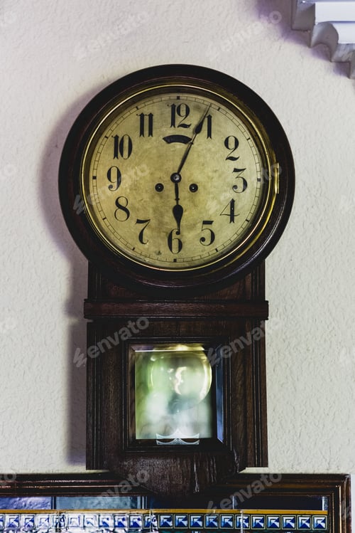 Preview: Old wall clock marking the passage of time