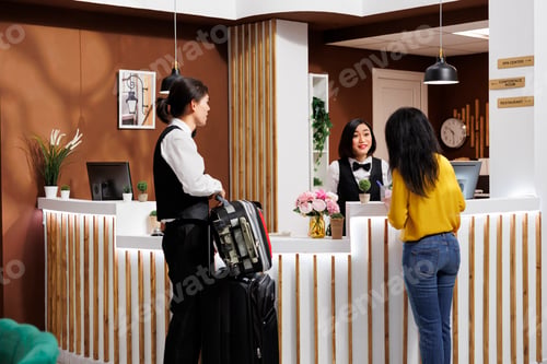 Preview: Hotel staff helps client settle in