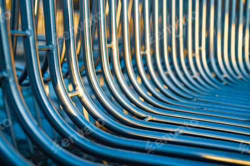 Preview: Close-up street bench metal pipes arranged parallel