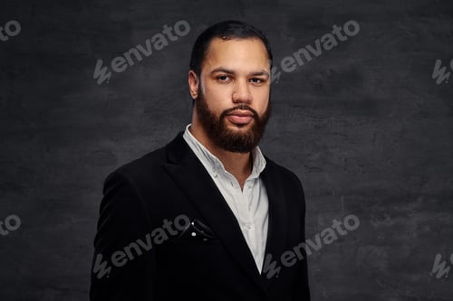 Preview: Confident African-American businessman in a black classic jacket.
