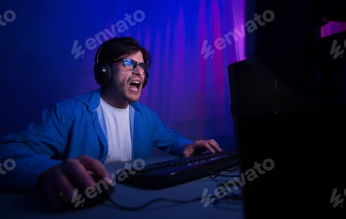 Preview: Emotional gamer playing video game online and shouting