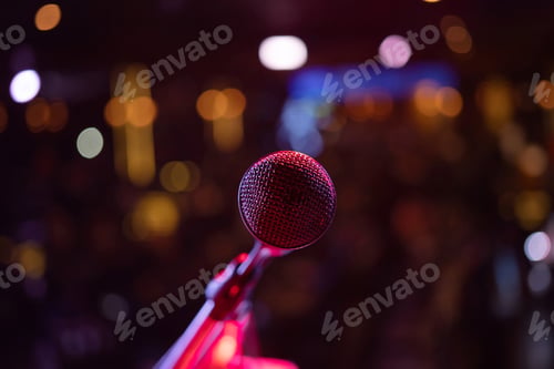 Preview: A microphone on stage with lighting laser beam spotlight show in disco pub club bar for party music