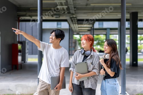 Preview: Three young people are standing in a large, empty building