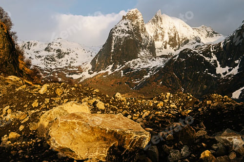 Preview: Boulder, rocks and snow capped mountain, Reine, Lofoten, Norway