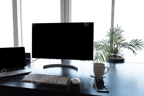 Preview: Home office desk work station with computers, keyboard, mouse and coffee.