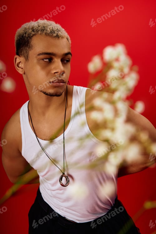 Preview: Dynamic style inspiration featuring a young man in a striking red setting