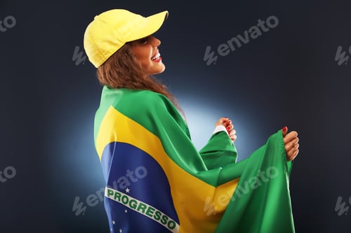 Preview: Happy Brazilian fan cheering with flag