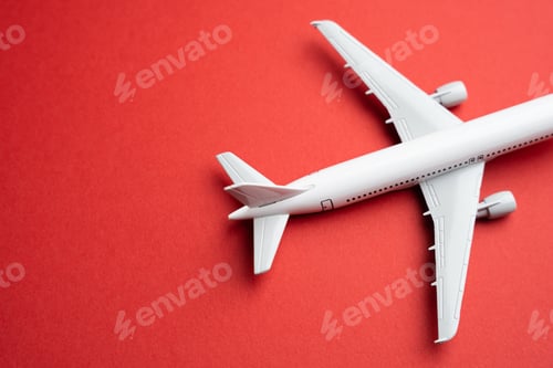 Preview: Airlines plane on a red background. Booking flight tickets.