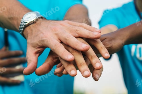 Preview: Team of volunteers stacking hands