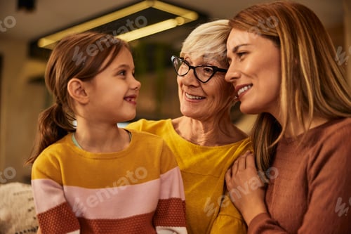 Preview: A little girl spending time with her mother and grandma, at home.