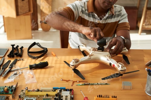 Preview: Repairman applying machine oil