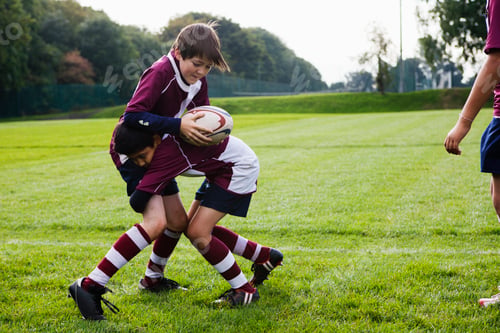 Preview: Teenage schoolboy rugby team practicing defence