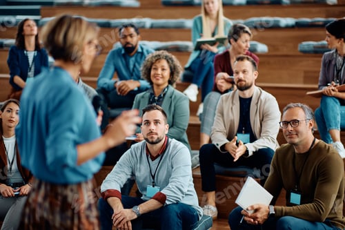 Preview: Large group of entrepreneurs attending a business seminar at conference hall.