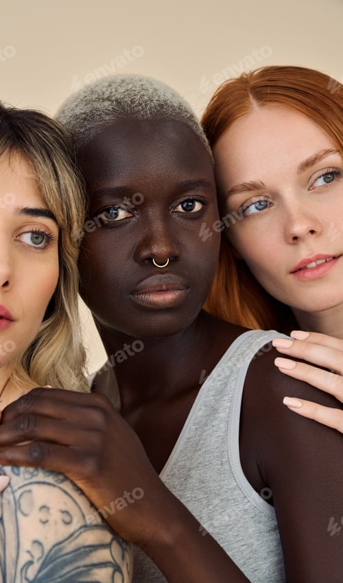 Preview: Three cool pretty young women looking at camera, beauty vertical shot.