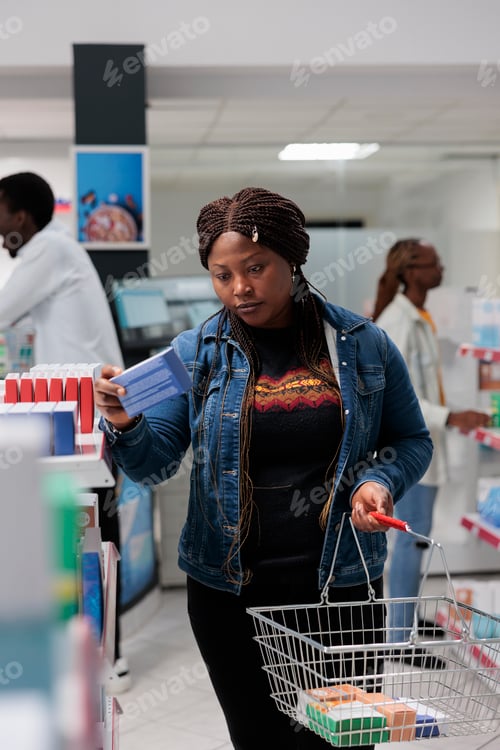 Preview: African american customer buying medication in pharmacy, reading instruction