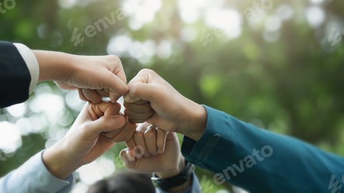 Preview: business teamwork of various young volunteers shaking hands Business team extending hands