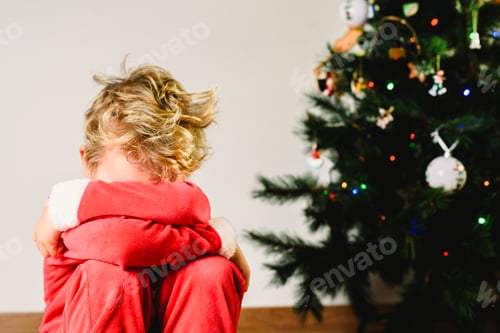 Preview: Child with disguise, anxious and sad on Christmas day